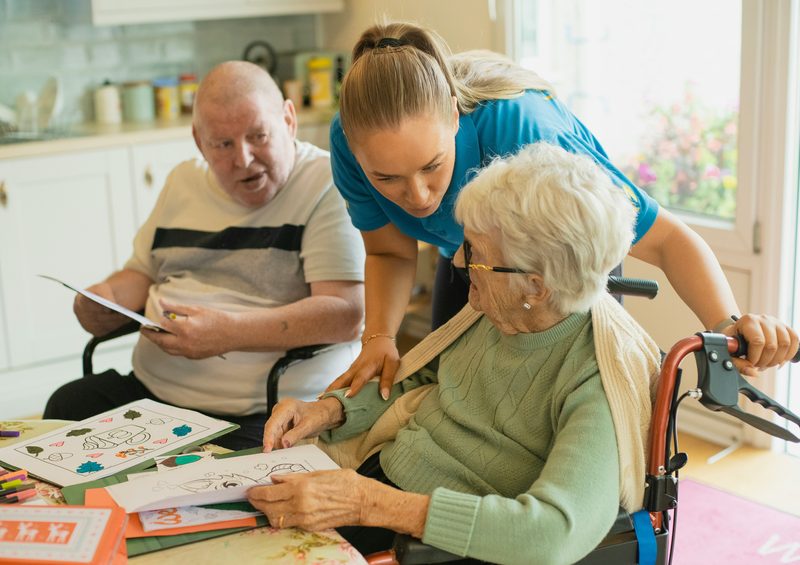 Caregiver supporting a senior with Alzheimer's care
