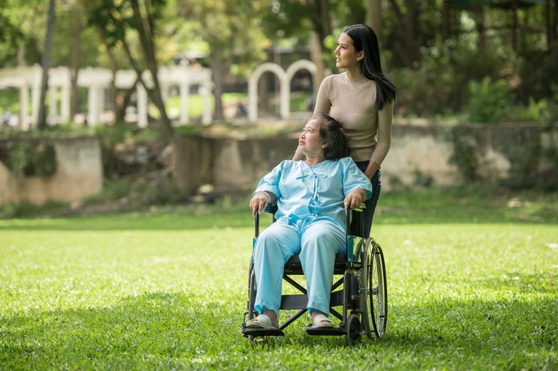 Caregiver helping a senior transition safely from hospital to home