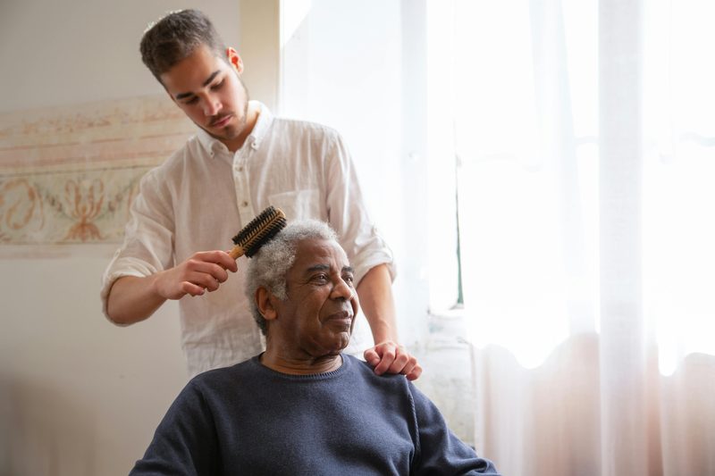Caregiver helping a senior with personal care at home